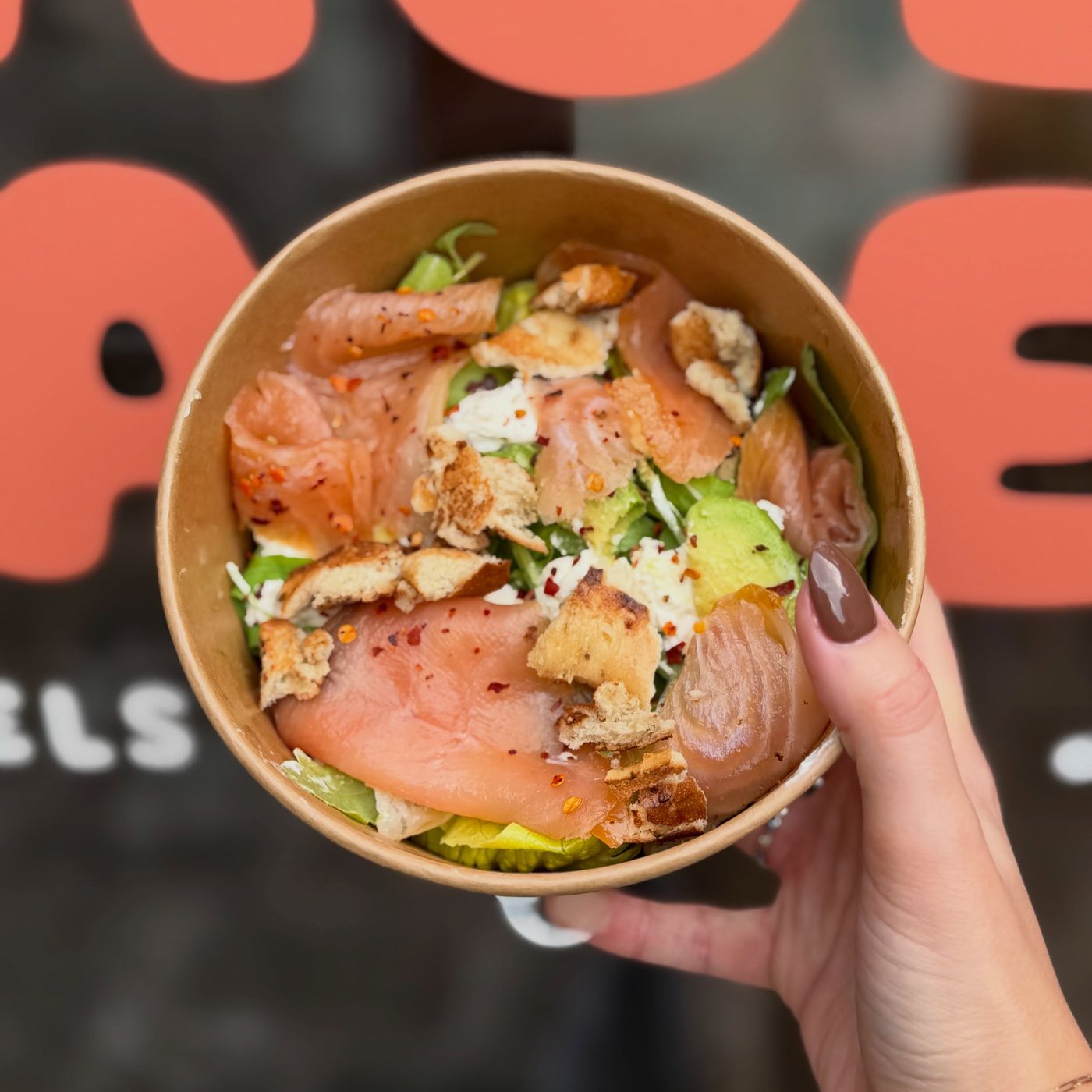 A salmon and avocado bagel bowl with cream cheese
